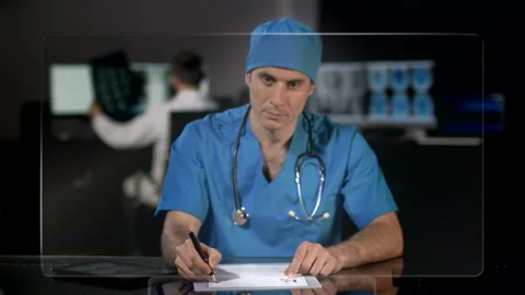 Surgeon Working With A High Tech Screen Stock-Footage 210429547