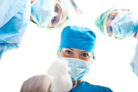 Surgeons above patient Stock Photos