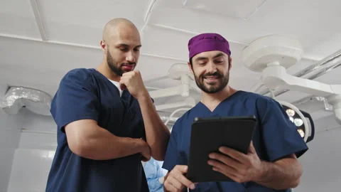 Surgeons Analyzing Medical Data Stock Footage 315984132