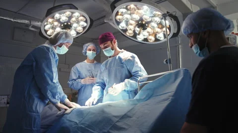 Surgeons and Nurses During Surgery Stock Footage 315988942