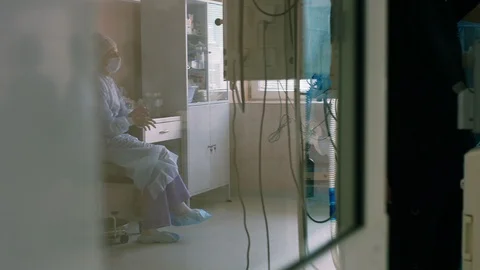 Surgeons assistant is tired at the surgery operation Stock Footage