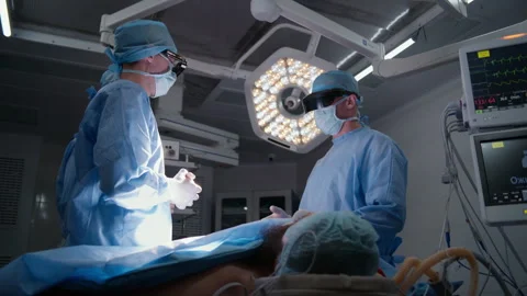 Surgeons discuss process of surgical operation Stock Footage 252112193