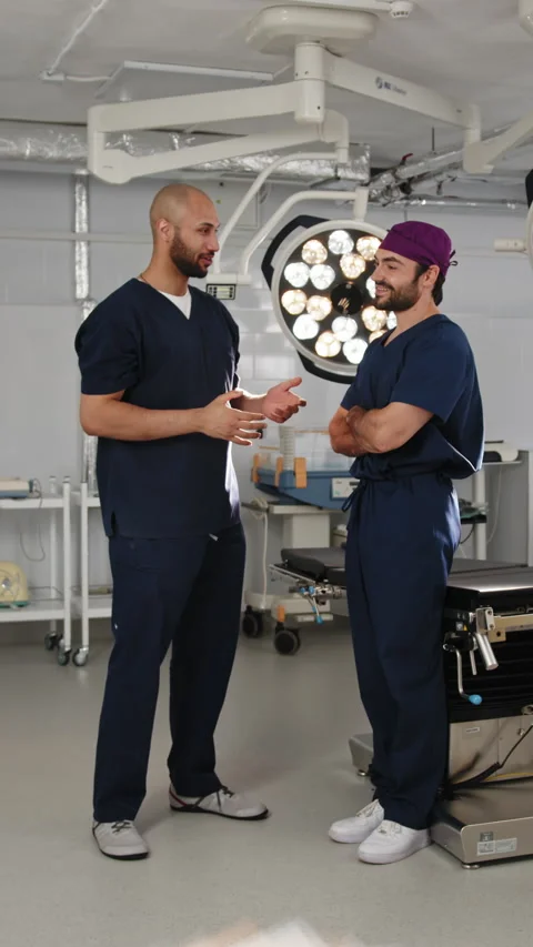 Surgeons Discussing in Operating Room Stock Footage 316191974