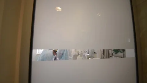 Surgeons do surgery in a modern operating Stock Footage 79620558