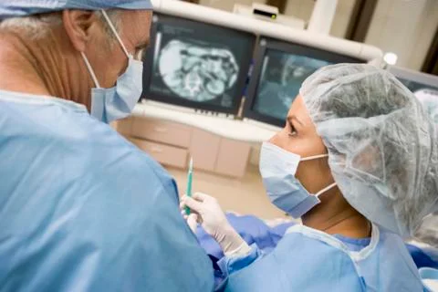 Surgeons During An Operation Foto stock