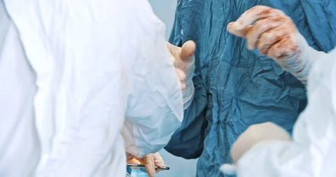 Surgeons during operation with surgical laparoscopy instruments. Medicine Stock Footage 121098279