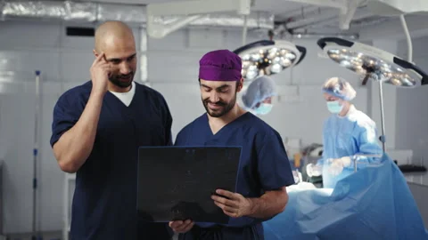 Surgeons Examining X-ray in OR Stock Footage 315992992