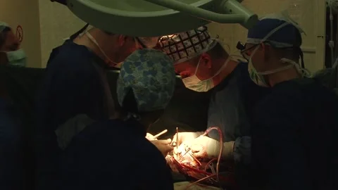 Surgeons on heart surgery Stock Footage 130377305