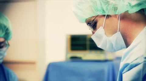 Surgeons operating iv bags Stock Footage