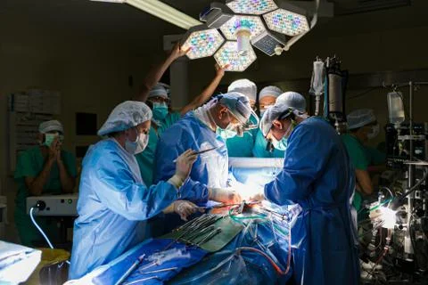 Surgeons in the operating room with a patient Stock Photos