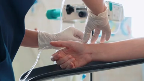 Surgeons in the operating room prepare the patient for surgery. A close-up of Stock Footage 220521821