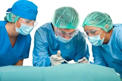Surgeons in operations Stock Photos