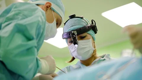 Surgeons perform cosmetic surgery with the help of modern innovative medical Vídeo Stock 96308737