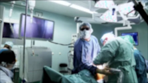 Surgeons perform laparoscopic surgery. Shooting in a dark room. Blurred video. Stock Footage 149888783