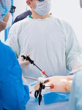 Surgeons perform laparoscopic surgery using special medical instruments. Stock Photos