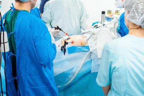 Surgeons perform laparoscopic surgery using special medical instruments. Stock Photos