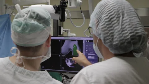 Surgeons perform the operation with a modern robot. Video stock 164118505