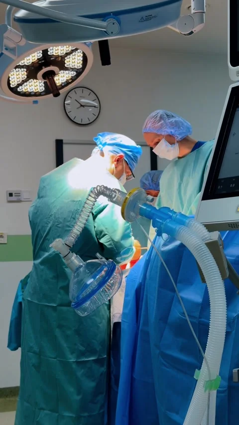 Surgeons perform surgery in hospital operating room during daylight hours Video stock 328322584