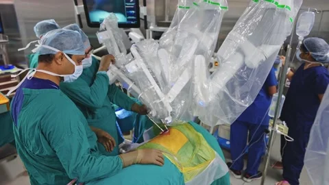 Surgeons perform surgery using a robot Stock Footage 225337142