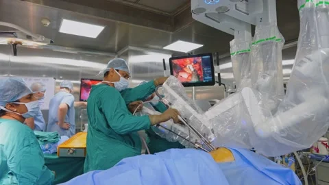 Surgeons perform surgery using a robot Video stock 225337174