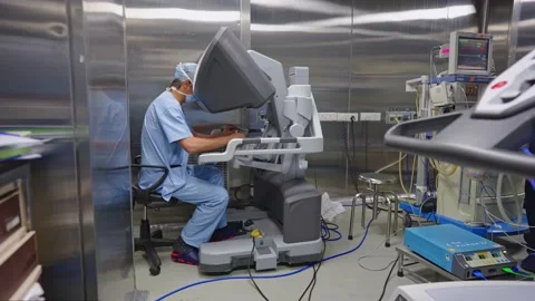 Surgeons perform surgery using a robot Stock Footage 225337232