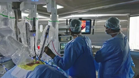 Surgeons perform surgery using a robot Stock Footage 230071030