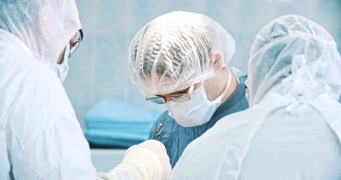 Surgeons performing a difficult operation. Medicine, surgery, health care Stock Footage 121102989