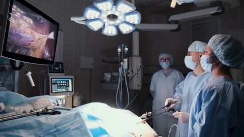 Surgeons performing laparoscopic surgery in modern operating room Stock Footage 306167869