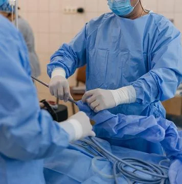 Surgeons performing laparoscopic surgery with professional endoscopic equipme Stock-Fotos