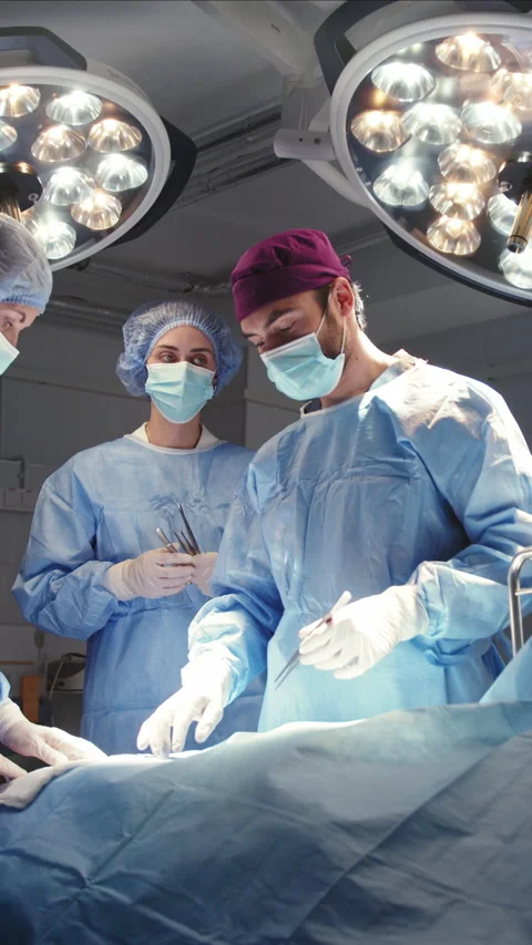 Surgeons Performing a Medical Procedure Stock Footage 316193143