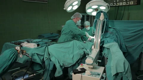 Surgeons performing operation in hospital operating room, orthopedic operation. Stock Footage 50955790