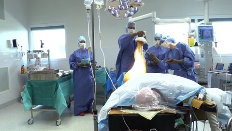Surgeons preparing the patient for the operation Stock Footage 85937357