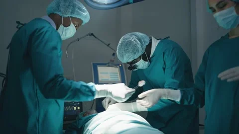 Surgeons processing surgical operation in operating room Stock Footage 197779439