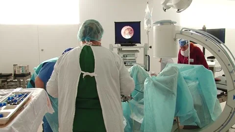 Surgeons remove a kidney stone Stock Footage 130793930