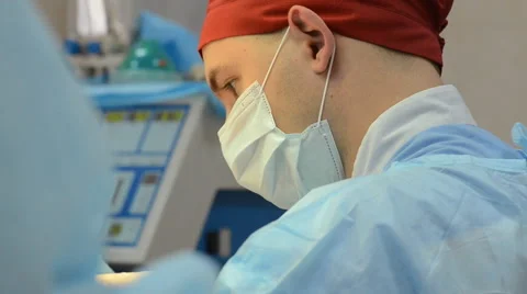 Surgeons team operates with the patient Stock Footage 64544107