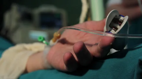 Surgeons team performing operation arm in hospital operating room. Hand close up Stock Footage