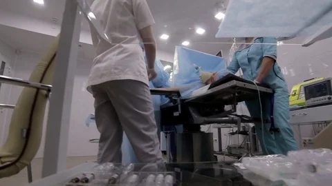 Surgeons team performing surgical operation,operating room. A team of Stock Footage 82851746