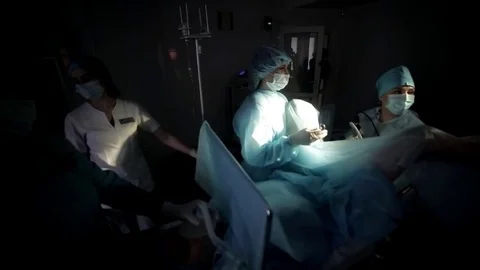 Surgeons team performing surgical operation,operating room. Is the process of 動画素材 82891012
