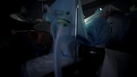Surgeons team performing surgical operation,operating room. Is the process of Stock Footage 82891031