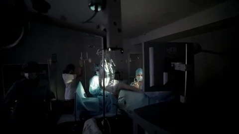 Surgeons team performing surgical operation,operating room. Is the process of Stock Footage 82891047