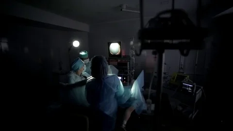 Surgeons team performing surgical operation,operating room. Is the process of Video stock 82891070
