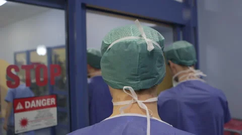 Surgeons walk in operating theater zone in hospital Stock-Footage 58259557
