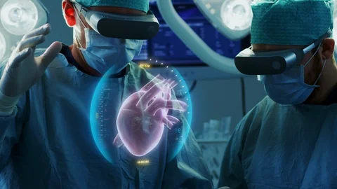 Surgeons Wearing Augmented Reality Glasses Perform Heart Surgery. Stock Footage 90933237