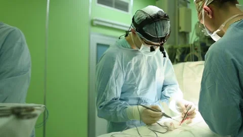 Surgeons at work. female nurse operating in child surgery hospital Stock Footage 85790775