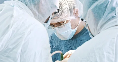 Surgeons at work inoperation in operating theatre. Medicine, surgery, health Stock Footage 121103817