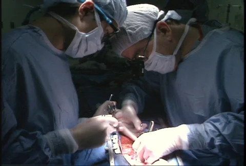 Surgeons working during open heart surgery Stockbeeldmateriaal 149617