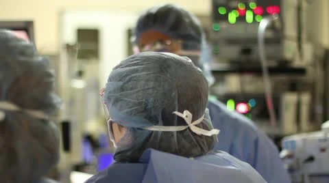 Surgeons Working in OR - dolly shot Stock Footage