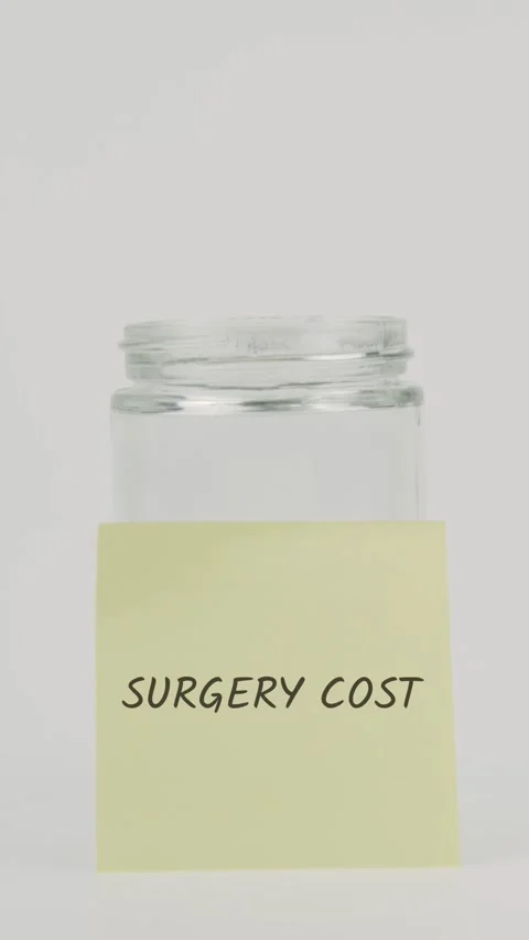 Surgery cost text or word on yellow sticky note attached to glass jar Stock Footage 311793360