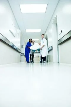 Surgery, emergency and low angle with doctors in hospital for team, medical cris Stock Photos