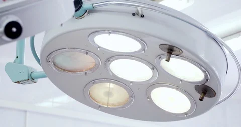 A surgery light during operation. Medicine, surgery, health care concept. Filmed Video stock 121095660